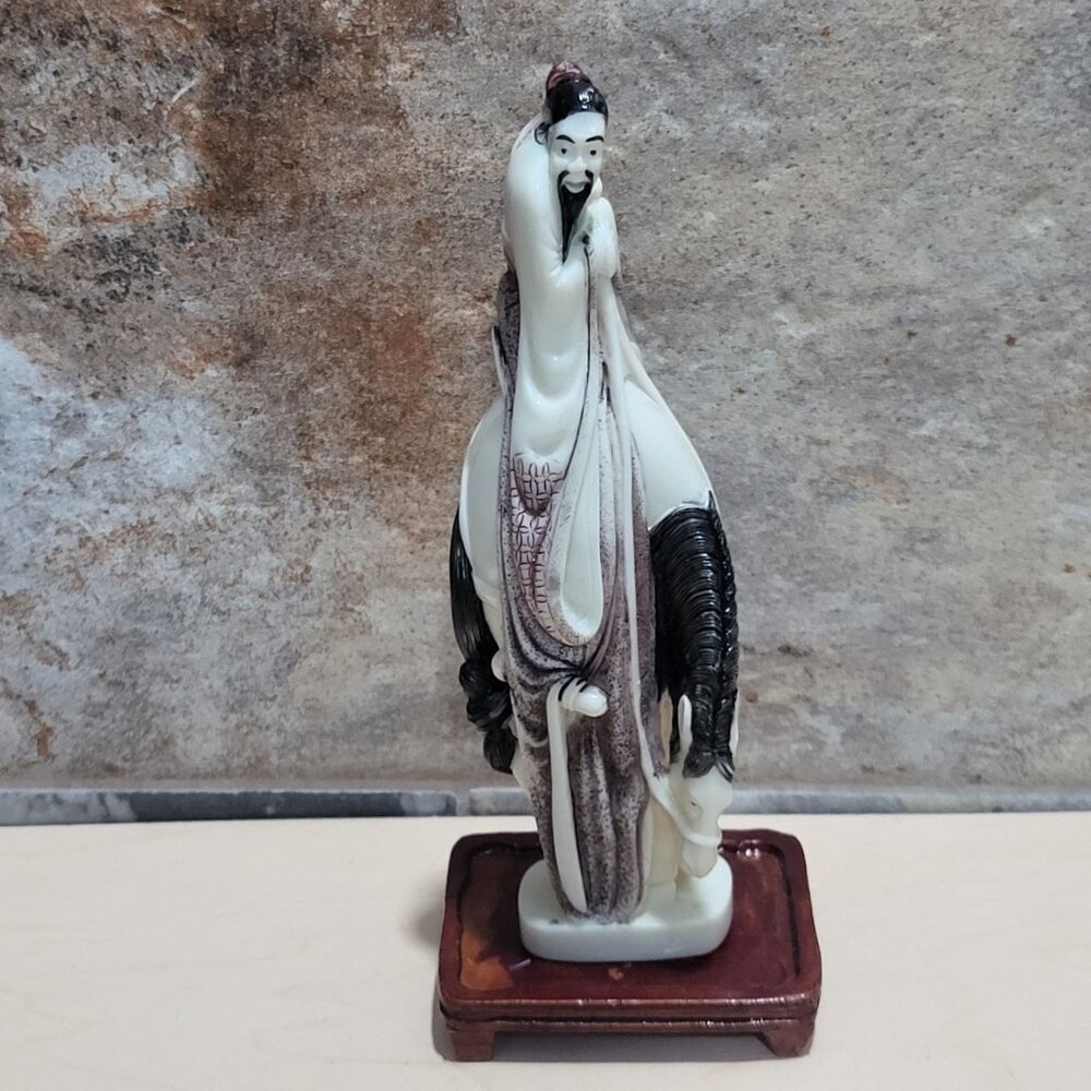 A Japanese Carved Okimono Man on Horseback